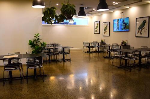 a group of tables and chairs in a room at Grafton Hotel in Grafton