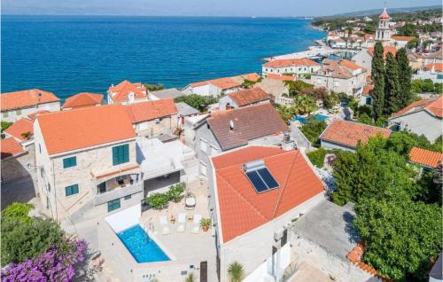 an aerial view of a town with the ocean at Beautiful Home In Sutivan With Wifi in Sutivan