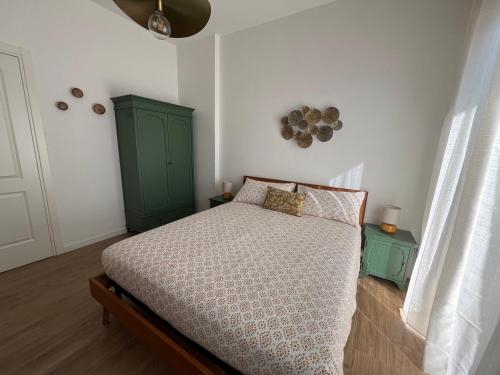 Ένα ή περισσότερα κρεβάτια σε δωμάτιο στο LuLi Rooms Napoli