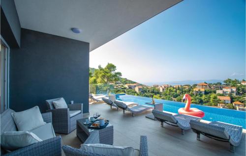 a living room with a pool with chairs and a swan toy at Pet Friendly Home In Prigradica in Prigradica