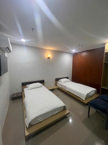 Katil atau katil-katil dalam bilik di Hotel Stylish Tân Khai