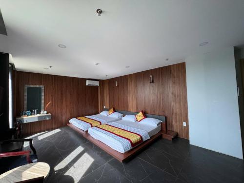 Katil atau katil-katil dalam bilik di Hotel Stylish Tân Khai