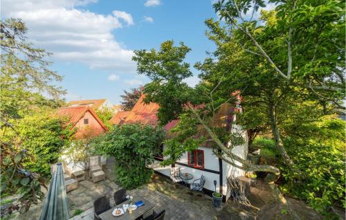 an overhead view of a house with trees at 3 Bedroom Gorgeous Home In Nexø in Neksø
