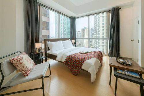 Katil atau katil-katil dalam bilik di Prime Avant BGC Location Apartments by PH Staycation