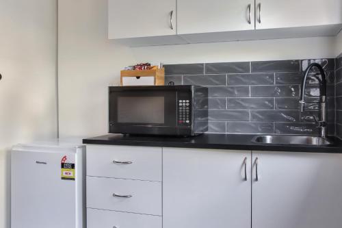 Η κουζίνα ή μικρή κουζίνα στο Highton Accommodation (Geelong)
