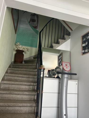 a stairway with a stair case and a staircase at Serenity Big Room in Brussels