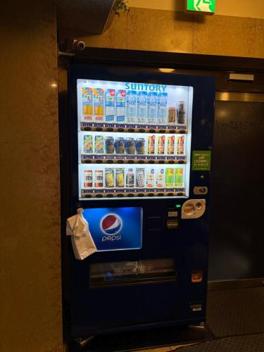 a vending machine with soda and sodas on it at Hotel SUNROAD Adult Only in Tokyo