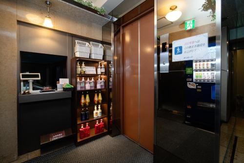 a store with a vending machine in a room at Hotel SUNROAD Adult Only in Tokyo