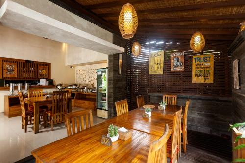 a dining room with a table and chairs in it at Kadiga Villas Ubud by GenuineHost in Ubud