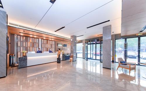 Katil atau katil-katil dalam bilik di Echarm Hotel Xiaogan Yingcheng Stadium Store