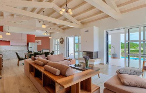a living room with a couch and a table at Villa Arkaim in Pula