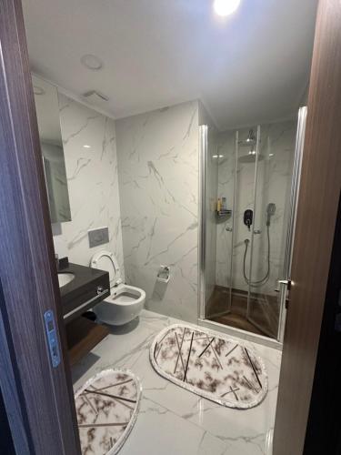 a bathroom with a shower and a toilet at Grand Sapphire Casino studio 20 in Iskele