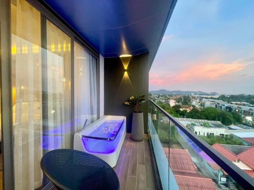 a balcony with a bath tub on top of a building at The Blue Mavi Hotel in Chalong 