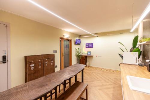 an empty room with a counter and a sink at Hostel Mihojae Incheon in Incheon