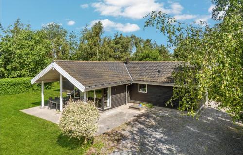 an overhead view of a house with a yard at Holiday Home Bæverstien Xi Dnmk in Marielyst