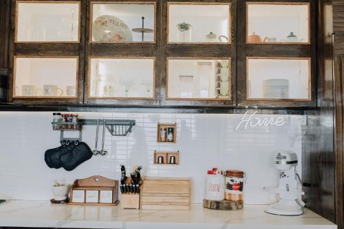 a kitchen counter with many different items on it at The French Villa-Santander Cebu in Santander