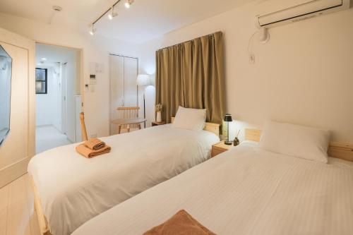 Katil atau katil-katil dalam bilik di Calm Riverside Inn Close to Ikebukuro