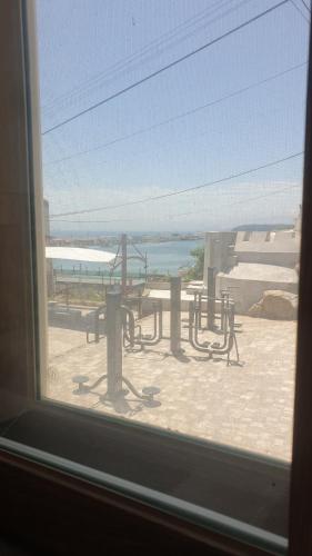 a window with a view of the beach and the ocean at Donghae ocean house in Donghae