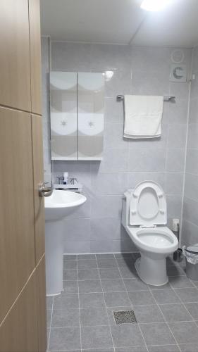 a bathroom with a toilet and a sink at Donghae ocean house in Donghae