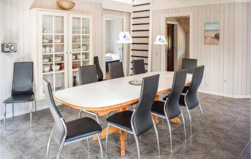 a dining room with a table and chairs at Holiday Home Lyngvej Tranekær Ii in Hou
