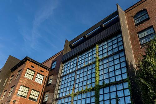 a tall building with windows on the side of it at The LOOM Hotel, Tapestry Collection by Hilton in Warwick