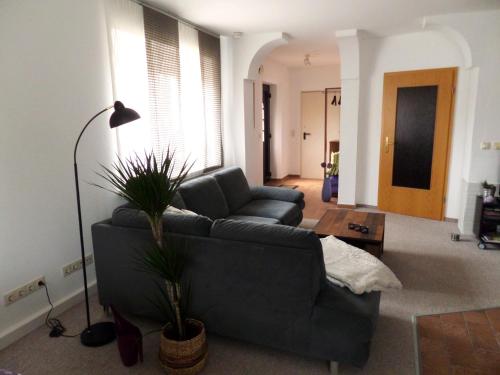 a living room with a couch and a table at Elbflair in Zahna-Elster