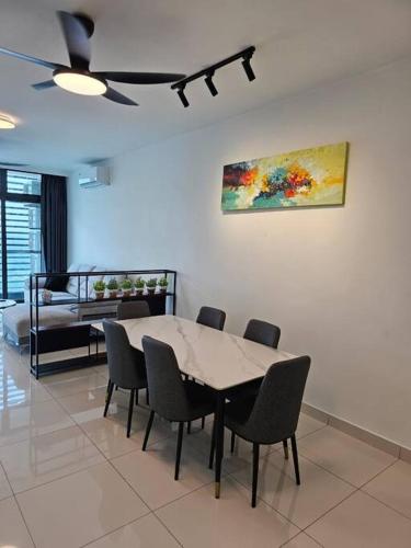 a dining room with a table and chairs at Green Haven Unique Relaxing Home & Netflix in Masai