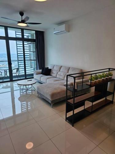 a living room with a couch and a table at Green Haven Unique Relaxing Home & Netflix in Masai