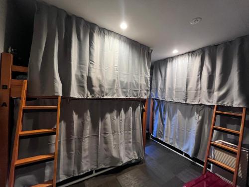 Postel nebo postele na pokoji v ubytování Mini Inn Kyoto-外国人向け - 日本人予約不可