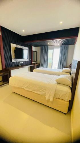 Cama o camas de una habitación en Resort Sur Beach Holiday