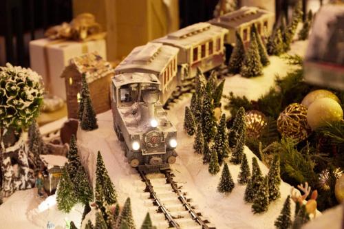 a model train on a track with christmas trees at The Westin Tokyo in Tokyo