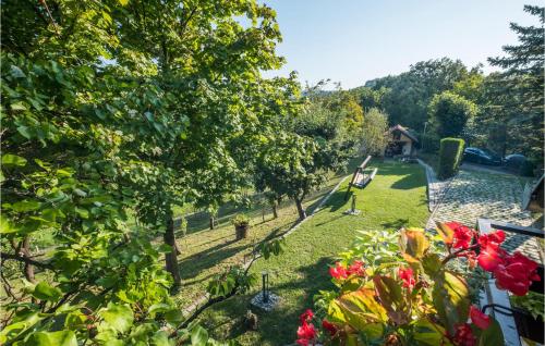 a view of a garden from a balcony at Beautiful Home In Bedenica With Sauna in Bedenica