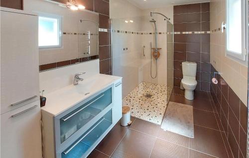 a bathroom with a sink and a toilet and a shower at Awesome Home In Sainte-Gemme-La-Plaine in Sainte-Gemme-la-Plaine