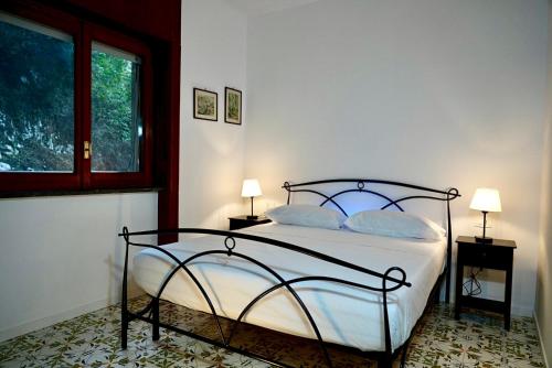 Ένα ή περισσότερα κρεβάτια σε δωμάτιο στο Riviera Apartment Sorrento