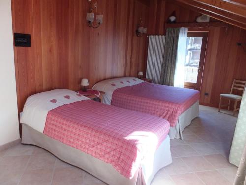 Een bed of bedden in een kamer bij Maison Gaudenzio