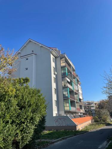 a building with graffiti on it next to a street at Apartman Petronela s parkovacím miestom in Bratislava