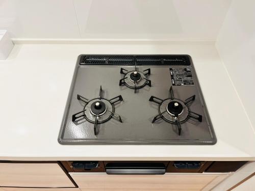 a stove top oven sitting on top of a counter at Casa Stella 4 by Liaison in Osaka