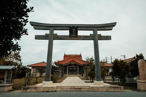 a large torii gate in front of a building at Rosewood Miyakojima in Miyako Island
