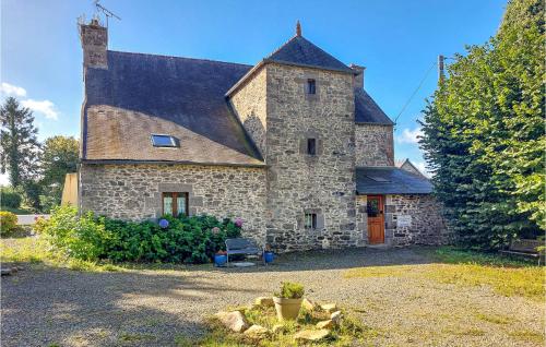 a large stone house with a large roof at 6 Bedroom Lovely Home In Tréguier in Tréguier