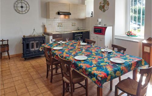 a kitchen with a table with a table cloth on it at 6 Bedroom Lovely Home In Tréguier in Tréguier