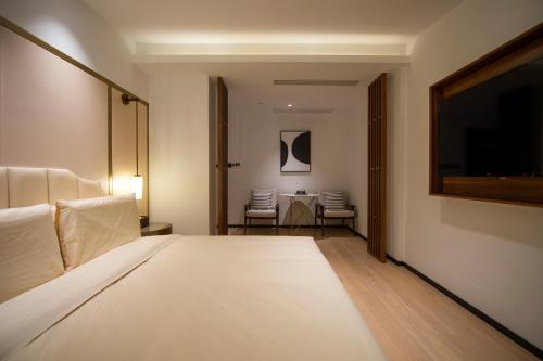 Katil atau katil-katil dalam bilik di Xishang Yunjian Holiday Hotel