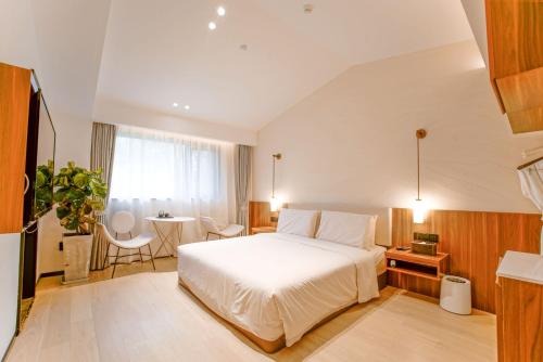Katil atau katil-katil dalam bilik di Xishang Yunjian Holiday Hotel