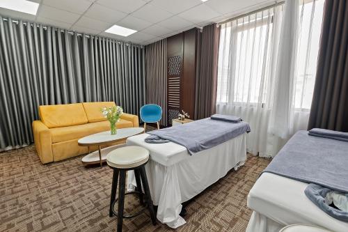 Katil atau katil-katil dalam bilik di Bradi Gate- 22Land Residence Hotel
