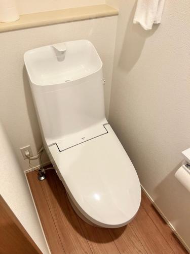 a bathroom with a white toilet in a room at Casa Stella 7 by Liaison in Osaka