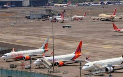 a group of planes parked on the runway at an airport at Jagannath Residency And Prasadam in Kolkata