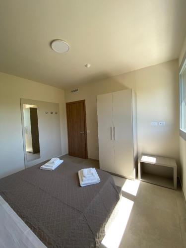 Postel nebo postele na pokoji v ubytování Residence Montefeltro Pesaro - Il Lupo Affitta
