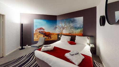 a hotel room with a bed and a painting on the wall at Novotel Lyon Gerland Musée des Confluences in Lyon
