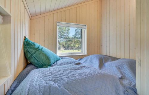 a bedroom with a bed with a window at Lovely Home In Skælskør With Kitchen in Skælskør