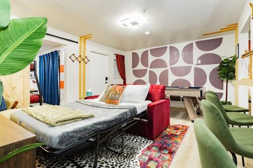 a room with a bed and a table and chairs at Star Motel Unit 5- New Downtown Haven Boutique Las Vegas Oasis Home in Las Vegas