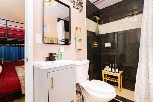 a bathroom with a toilet and a sink and a shower at Star Motel Unit 5- New Downtown Haven Boutique Las Vegas Oasis Home in Las Vegas